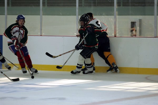2003 Seawolf Captain, Matt Shasby carries it up the ice.