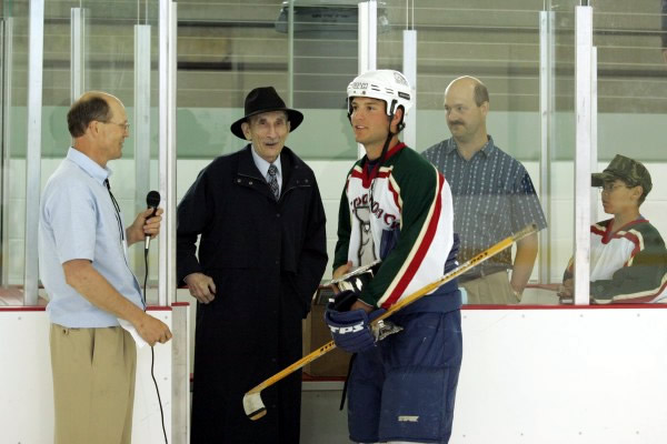 Retired UAF Professor Sarkis Atamian presents shootout champion Jackson Harren with the Atamian Cup!
